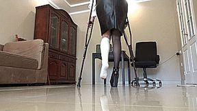 at work with a sprained leg