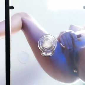 Riding transparent dildo on a glass table