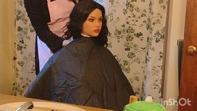 Emma the barberette shows off sexy vinyl shampoo capes