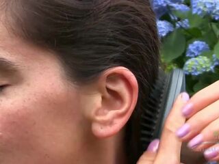 Slutty bushy honey sunbathes and masturbates with her vibrating hair brush.