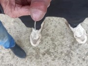 Friend is holding my cock while im peeing on the ground outdoor