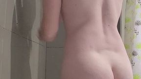 Camera catches girl showering and playing, showing ass and gathering soap all over