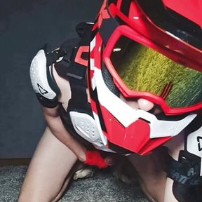 Naked boy in motocross gear and mxhelmet gets a strong orgasm