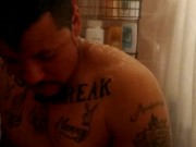 Sexy guy taking shower at the gym