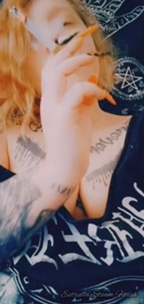 Metal girl smokes a cigarette
