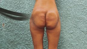 Punishment of a submissive with belt strikes