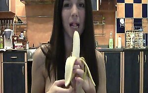 Naughty brunette with a banana on webcam