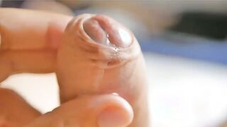 Watch this hunk's tiny dick get stretched by his own cum!