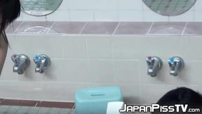 ”Playful Japanese chicks filmed pissing while taking a shower”