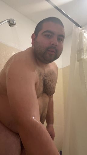 Chubby Latino guy stroking in the shower