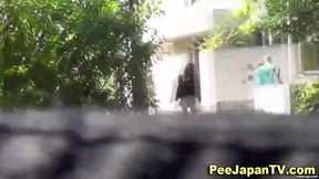 Asian teen squats to piss in public