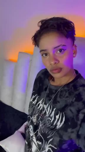 Lesbian tomboy Latina shows off her natural tits in a solo video
