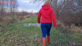 Red Hunter wellies and puffer jacket in the mud