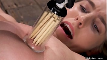 Cadence Lux is shackled and spread on the wooden floor