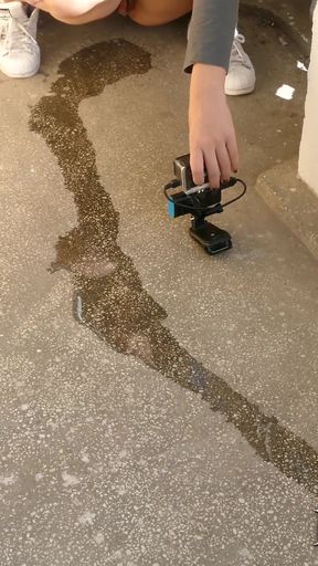 Desperate sexy girl with full bladder pee on balcony