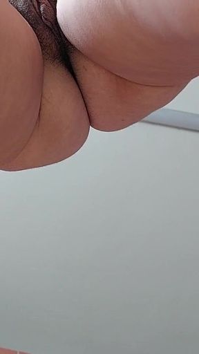 Key moment from &quot;Naughty sexy milf tries on naked clothes. Latin hairy pussy tries on clothes in bed.&quot;