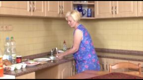 Old blonde German granny goes wild inside her pussy with a big young cock in the kitchen by fucking on the table