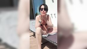 Neighbors catch a glimpse of busty MILF sunbathing naked