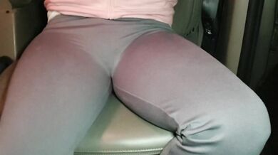 Blonde British girl soaks yoga pants texting in the car