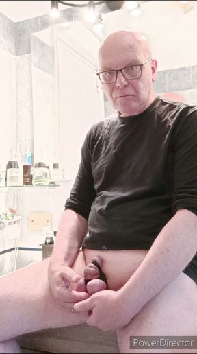 small caged cock and toothbrush