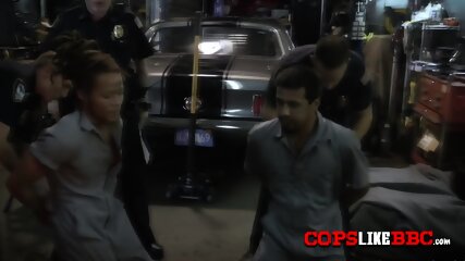 Car thief is fucking with two busty babes in his workshop.