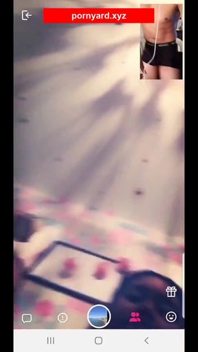 Amateur webcam model flashes a reaction to viewer's comments while teasing her t
