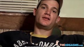 Handsome young man Glock rubbing his cock head on his sexy feet