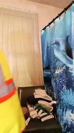 Construction worker gets dirty with a massive vibrating shower head