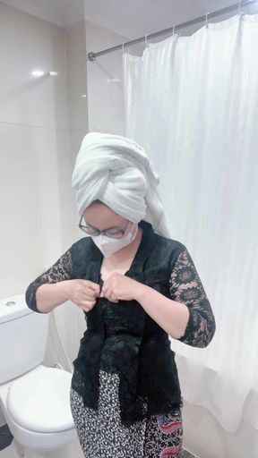 The charm of a black kebaya woman takes a shower and masturbates