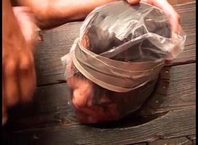 A sadistic man puts in the stocks a submissive girl made to suck his cock