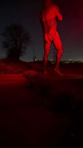 Wanking side of road In body stocking. Cars passing