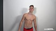 Muscle boy Jonathan Hicks shows his abs