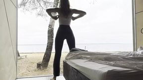 Sea-side goddess in yoga pants worships her own long legs