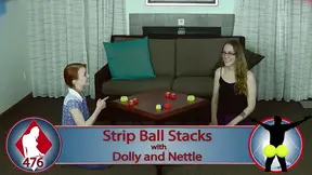 Lesbian lovers compete in a sexy strip game of balls