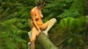 My sexy European wife in the woods naked on the trunk of the tree