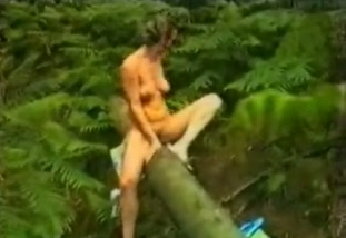 My sexy European wife in the woods naked on the trunk of the tree