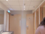 Topless girl mopping public washroom floor