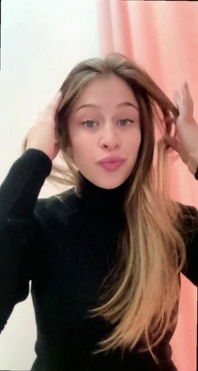 Blonde woman in black turtleneck