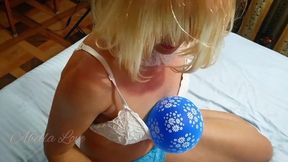 Kinky girl in gloves and socks popping balloon
