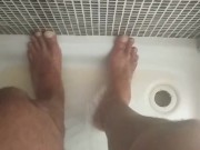 A piss on May male feet in the gym shower