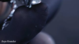 nylon foot fetish in black pantyhose with ice cube