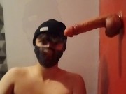 Handcuffed femboy suck a dildo with a chastity cage