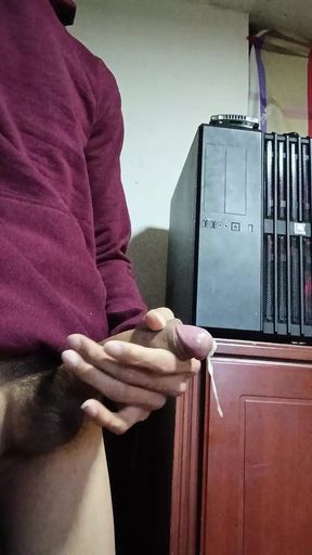 Latina cums on her cock in front of her computer
