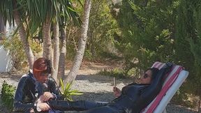 Feet massage under the palm tree