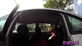 Simone sits in the backseat of a car, wearing tight pantyhose.