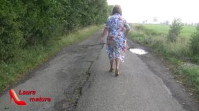 walking naked with nylons , high heels down the street.