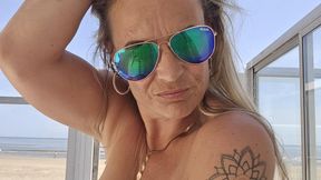 Hot milf Ashley laying naked in bed playing with herself