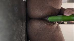 Riding two thick cucumbers