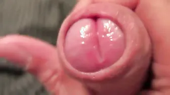 Solo uncut guy jerks off on couch and shoots close-up cum