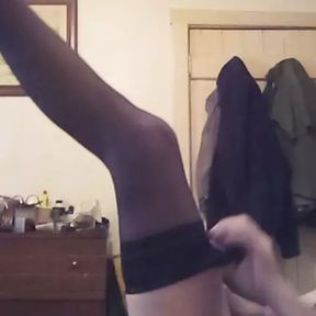 Mellissa puts stockings on her sexy legs